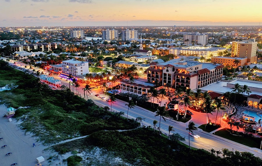 Aerial shot of Delray Beach, Florida, highlighting the coast and vibrant night life.